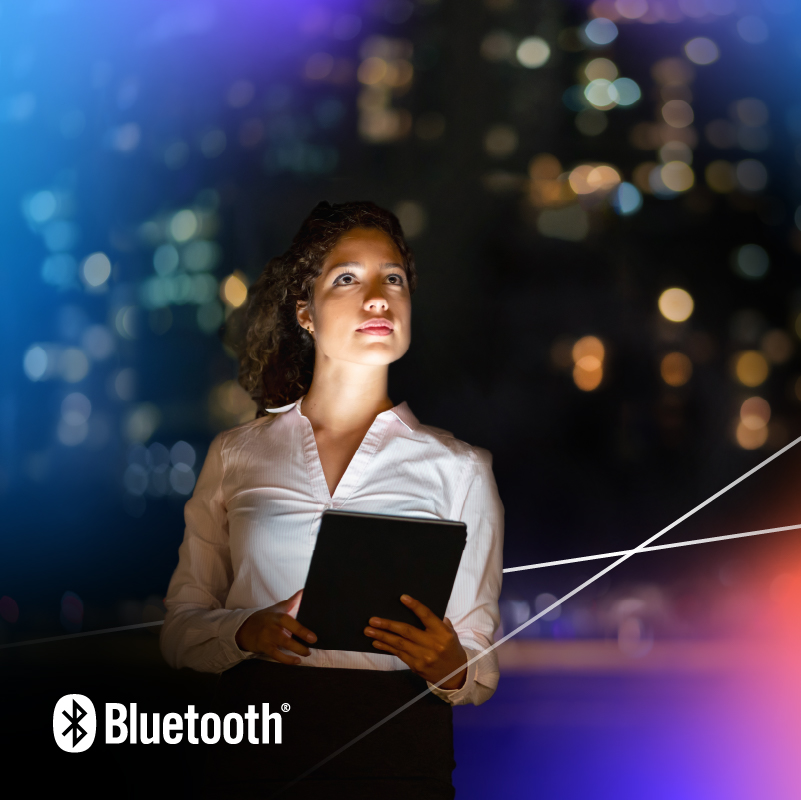 Young woman in white blouse gazes at city skyline, reflecting on technology and inspiration.